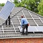 People installing solar pannels
